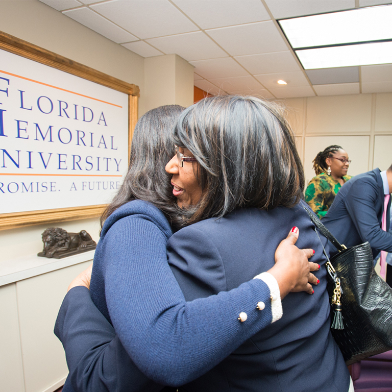 women hugging at Florida Memorial University in Miami Gardens